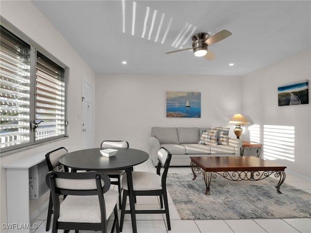 living room with a healthy amount of sunlight, light tile patterned floors, and ceiling fan