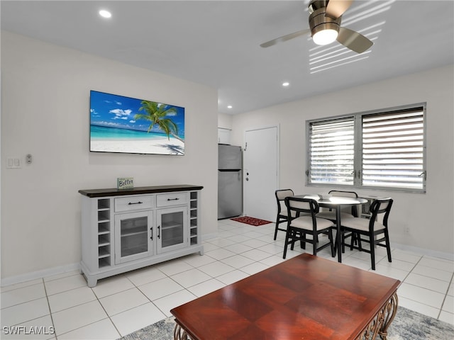 living room featuring ceiling fan and light tile patterned floors