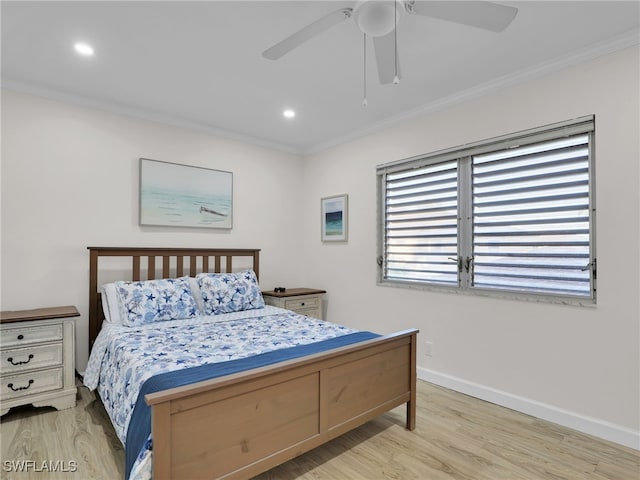 bedroom with ornamental molding, light hardwood / wood-style floors, and ceiling fan