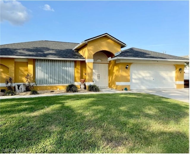 ranch-style home with a garage and a front lawn