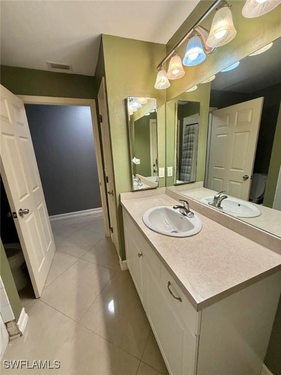 bathroom with vanity and tile patterned flooring