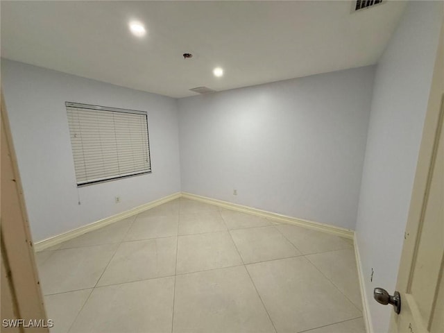 spare room with light tile patterned floors