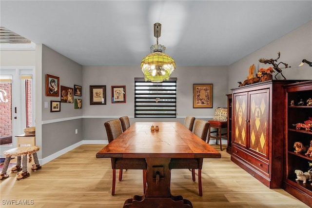 dining space featuring plenty of natural light and light hardwood / wood-style floors