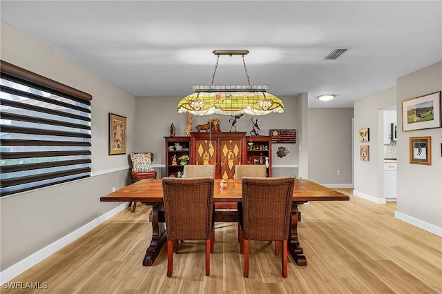 dining room featuring light hardwood / wood-style floors