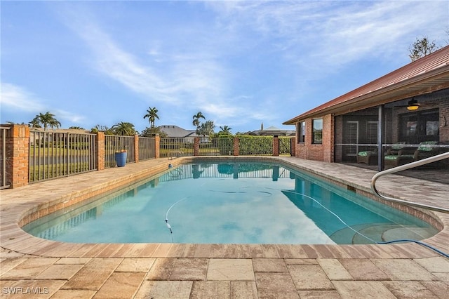 view of swimming pool with a patio area