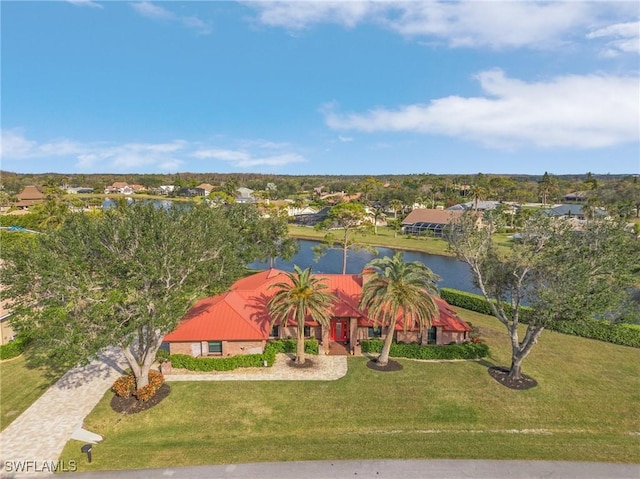 birds eye view of property with a water view