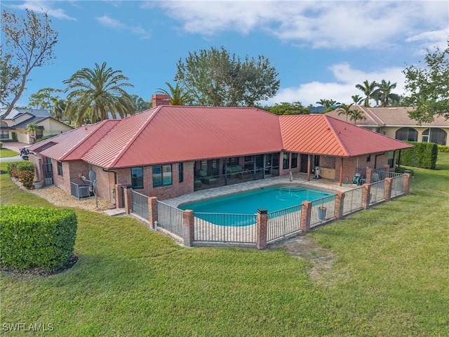 view of pool featuring a yard, central AC unit, and a patio