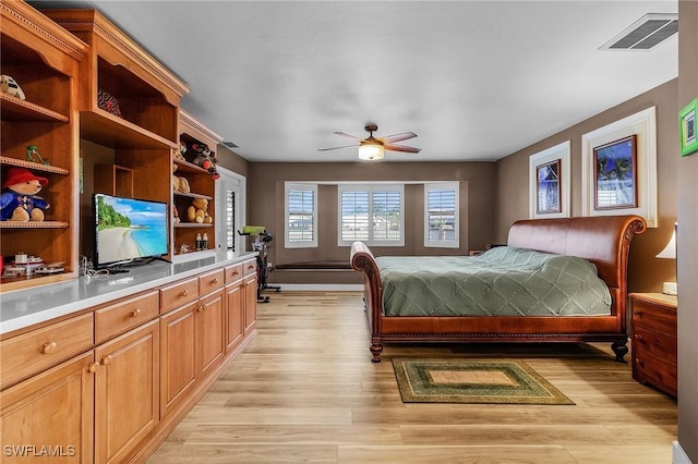 bedroom featuring light hardwood / wood-style flooring and ceiling fan