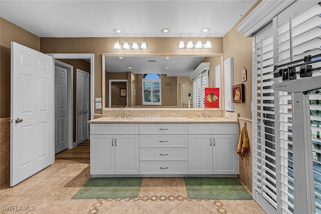 bathroom with vanity, tile patterned floors, and walk in shower