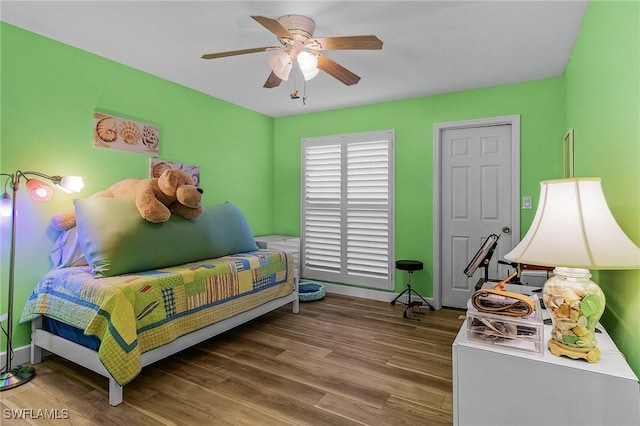 bedroom featuring hardwood / wood-style flooring and ceiling fan