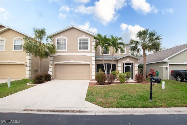 view of front of property with a garage and a front lawn