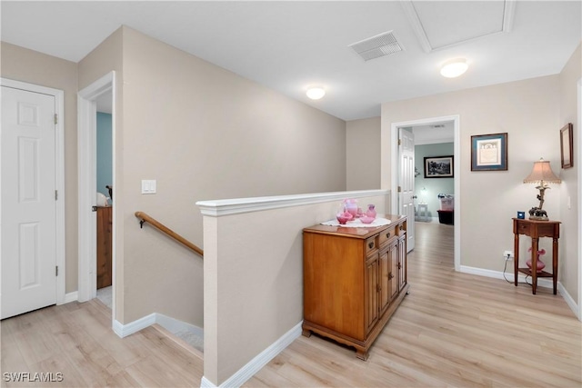 corridor featuring light hardwood / wood-style floors