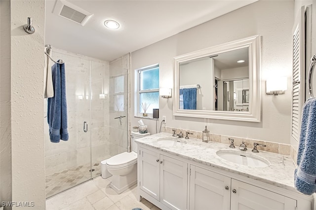 bathroom featuring vanity, toilet, and walk in shower