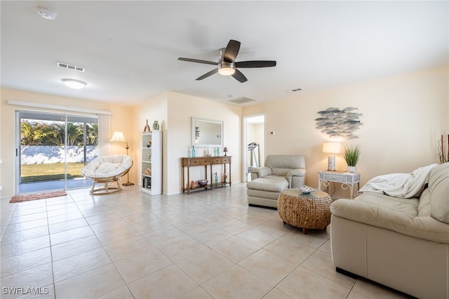 living room with ceiling fan and light tile patterned floors