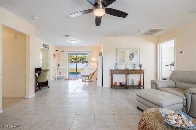 living room with light tile patterned flooring and ceiling fan