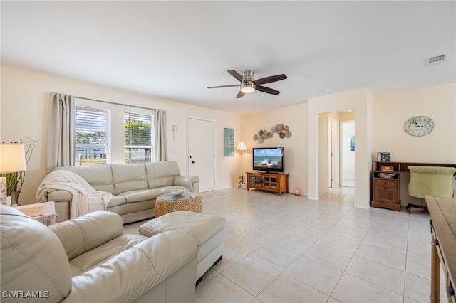 living room with light tile patterned flooring and ceiling fan