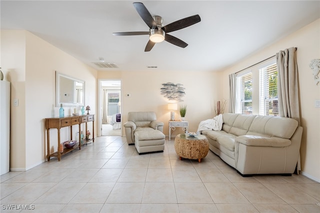 living room featuring ceiling fan and light tile patterned flooring