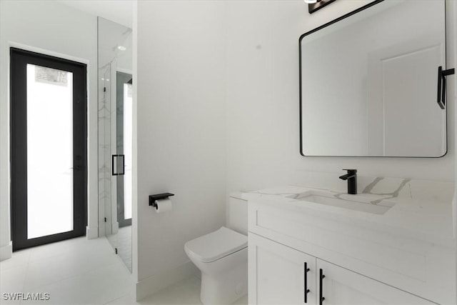 bathroom with vanity, toilet, and plenty of natural light