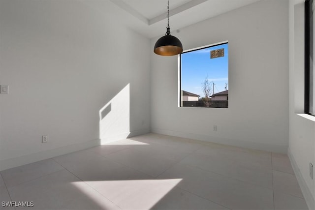 unfurnished room with tile patterned floors