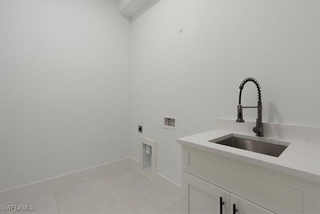 laundry room featuring sink, light tile patterned floors, electric dryer hookup, hookup for a washing machine, and cabinets