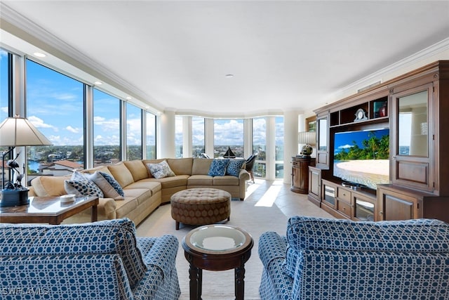 living room with crown molding and floor to ceiling windows