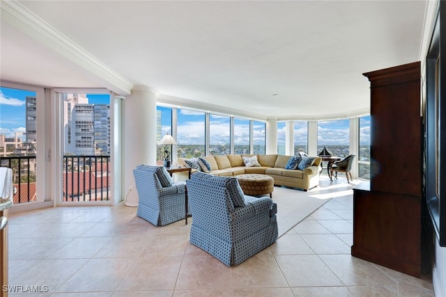 tiled living room featuring ornamental molding and a wall of windows