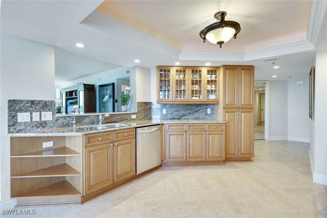 kitchen featuring sink, a tray ceiling, stainless steel dishwasher, light stone countertops, and decorative backsplash