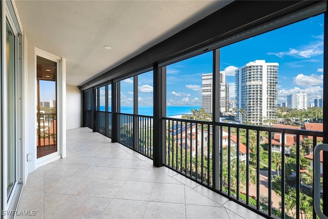 balcony featuring a water view