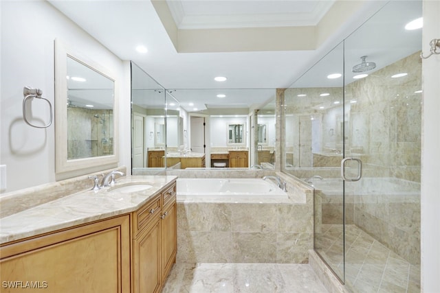 bathroom featuring shower with separate bathtub, crown molding, and vanity