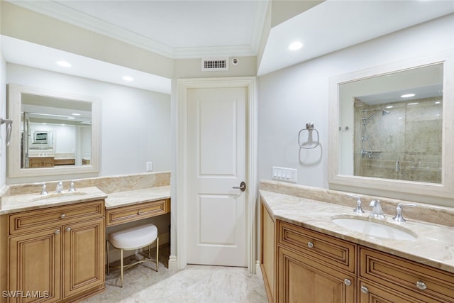 bathroom with ornamental molding, vanity, and a shower with door