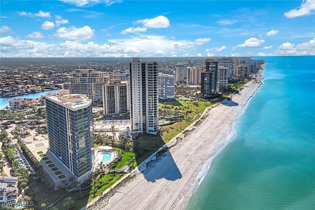 birds eye view of property featuring a water view and a view of the beach