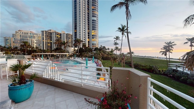 balcony at dusk with a patio area