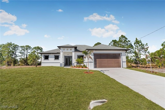 view of front of property featuring a garage and a front lawn