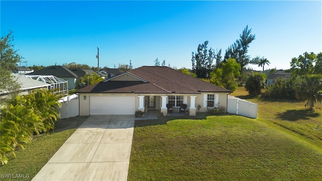 view of front of house featuring a garage and a front lawn