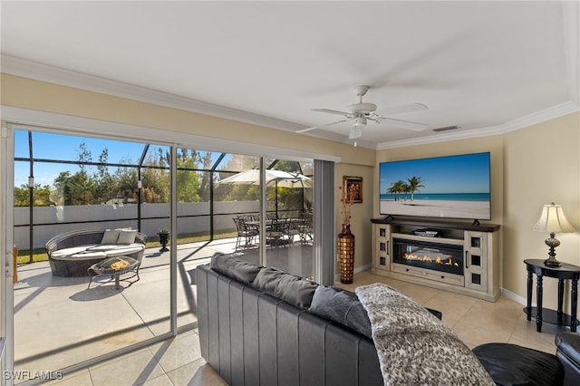 tiled living room featuring crown molding and ceiling fan