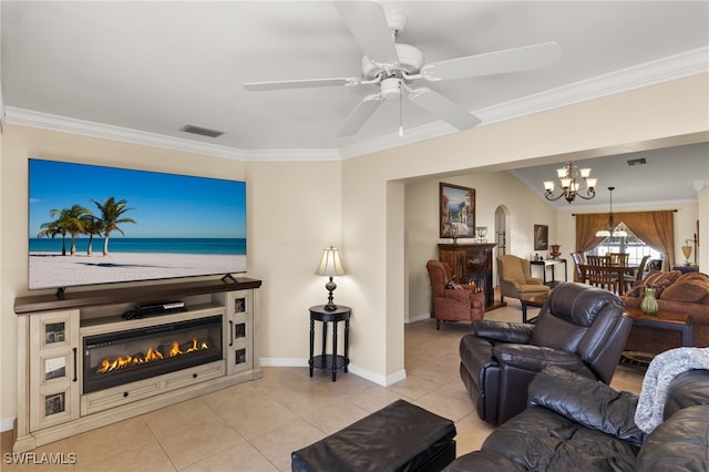 tiled living room featuring crown molding and ceiling fan with notable chandelier