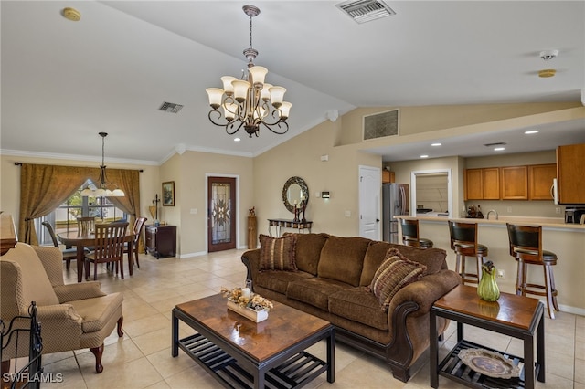 living room with an inviting chandelier, ornamental molding, lofted ceiling, and light tile patterned floors