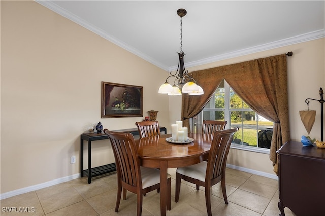 tiled dining space with crown molding and a chandelier