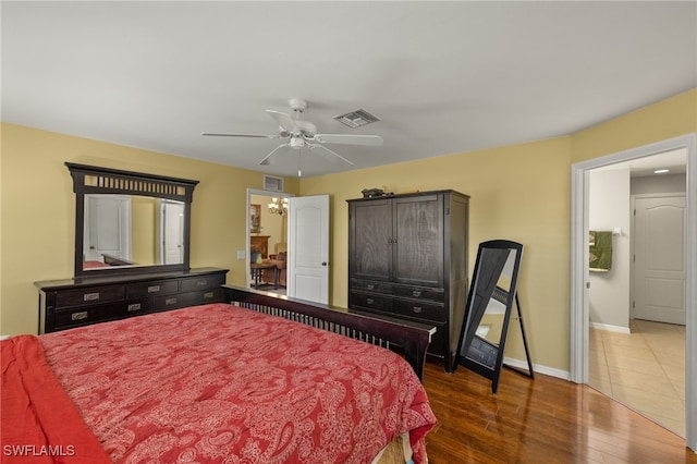 bedroom featuring ceiling fan and dark hardwood / wood-style flooring