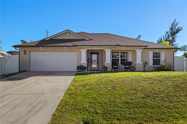 view of front of home with a garage and a front yard