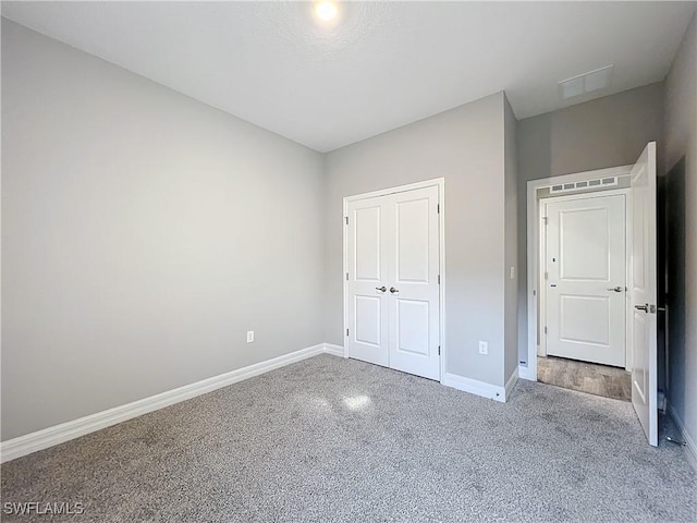 unfurnished bedroom with a closet