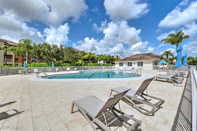 view of swimming pool with a patio area