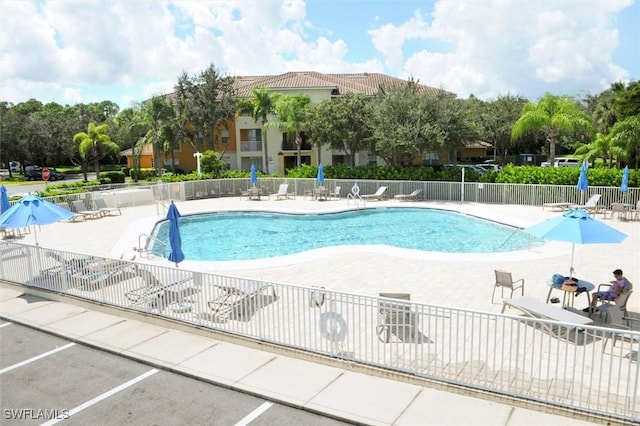 view of swimming pool with a patio