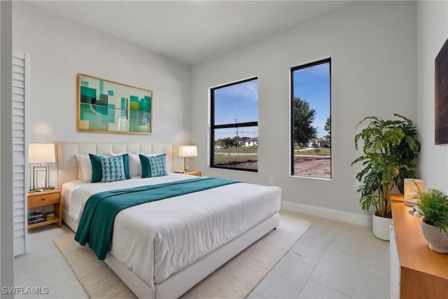 bedroom featuring baseboards