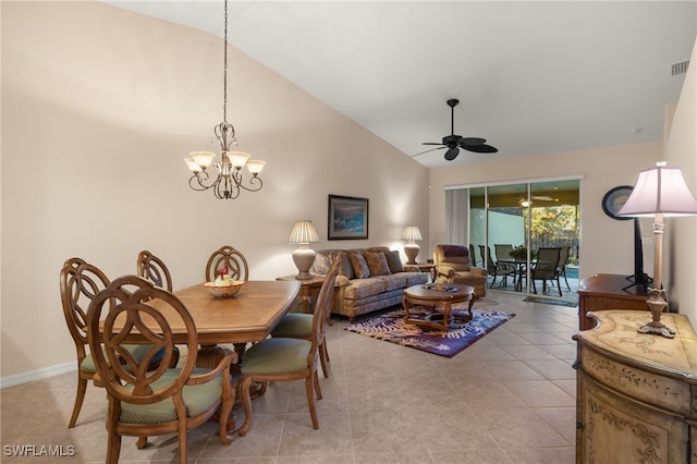 tiled dining room with high vaulted ceiling and ceiling fan with notable chandelier