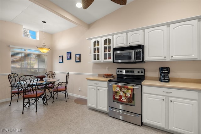 kitchen featuring appliances with stainless steel finishes, white cabinetry, hanging light fixtures, ceiling fan, and beam ceiling