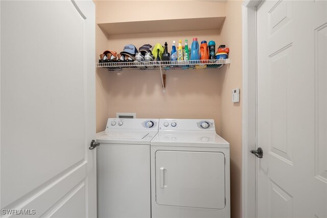 washroom with separate washer and dryer