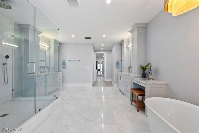 full bathroom with a freestanding tub, vanity, a shower stall, marble finish floor, and visible vents