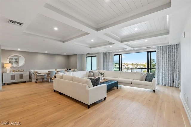 living room with coffered ceiling, recessed lighting, light wood-style floors, beamed ceiling, and visible vents