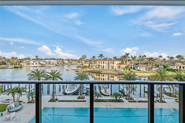 balcony with a water view and a residential view